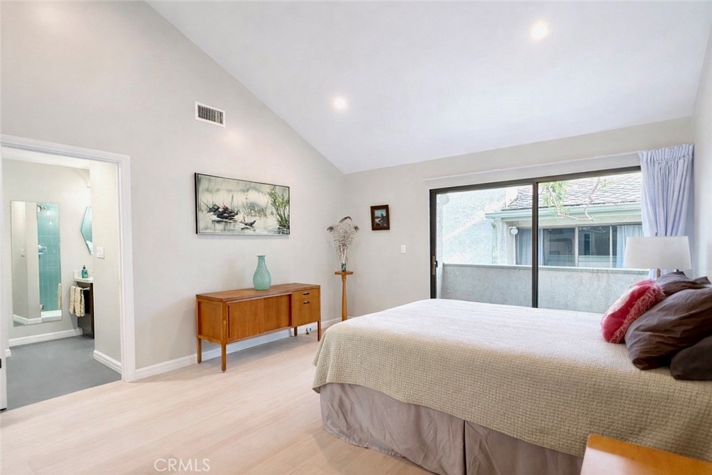 1108 18th Street, Unit 7 Santa Monica, CA 90403 - Photo 14 of 26 a bedroom with a bed and a large window
