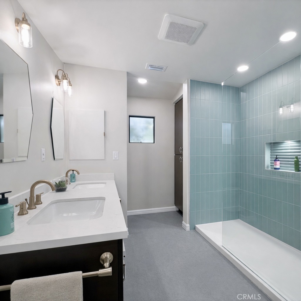 1108 18th Street, Unit 7 Santa Monica, CA 90403 - Photo 16 of 26 a bathroom with a sink and a mirror
