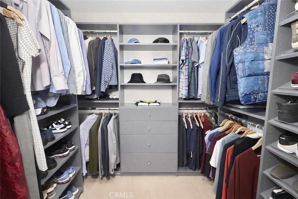 1108 18th Street, Unit 7 Santa Monica, CA 90403 - Photo 17 of 26 a view of walk in closet with clothes and shoes