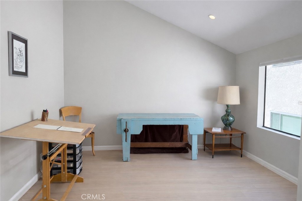 1108 18th Street, Unit 7 Santa Monica, CA 90403 - Photo 18 of 26 a living room with furniture and a table