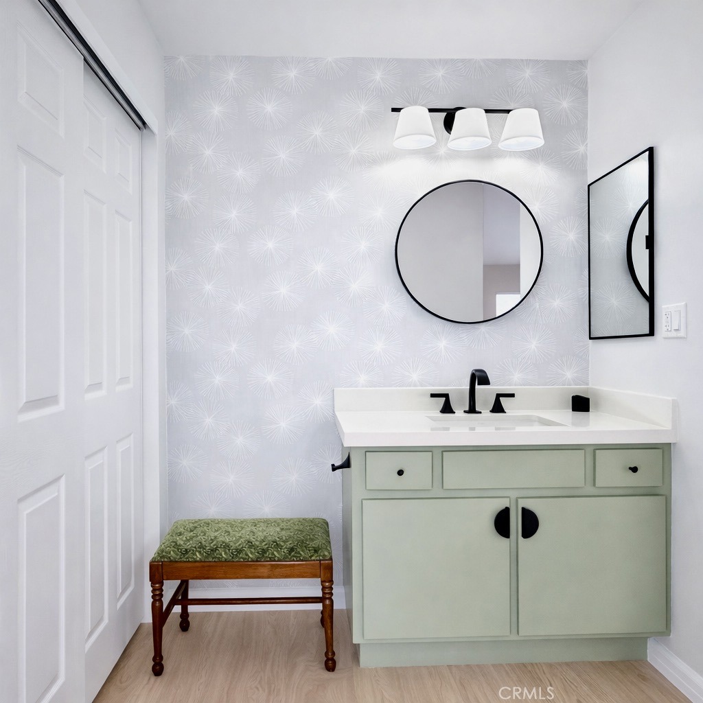 1108 18th Street, Unit 7 Santa Monica, CA 90403 - Photo 19 of 26 a bathroom with a sink mirror and vanity
