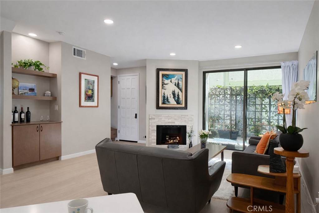 1108 18th Street, Unit 7 Santa Monica, CA 90403 - Photo 2 of 26 a living room with furniture and a fireplace