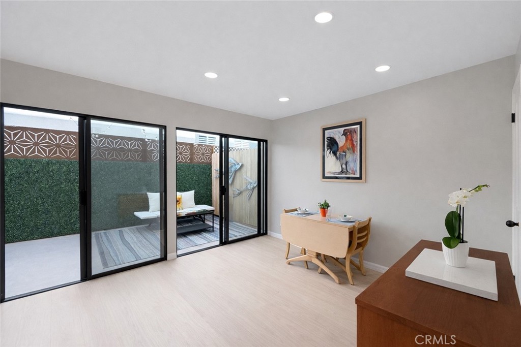 1108 18th Street, Unit 7 Santa Monica, CA 90403 - Photo 6 of 26 a living room with furniture and a floor to ceiling window
