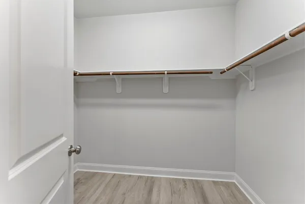 a view of an empty walk in closet