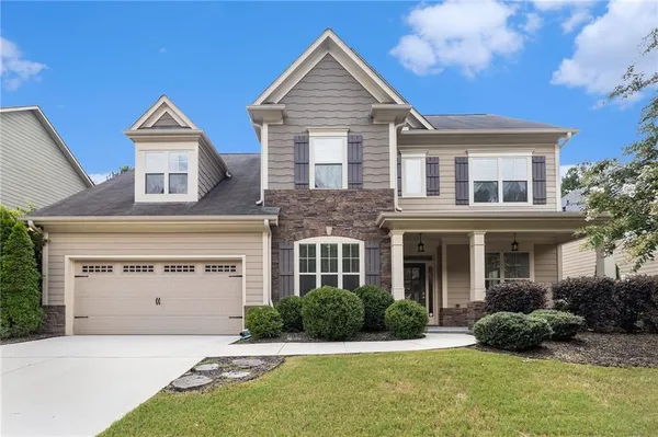 front view of a house with a yard
