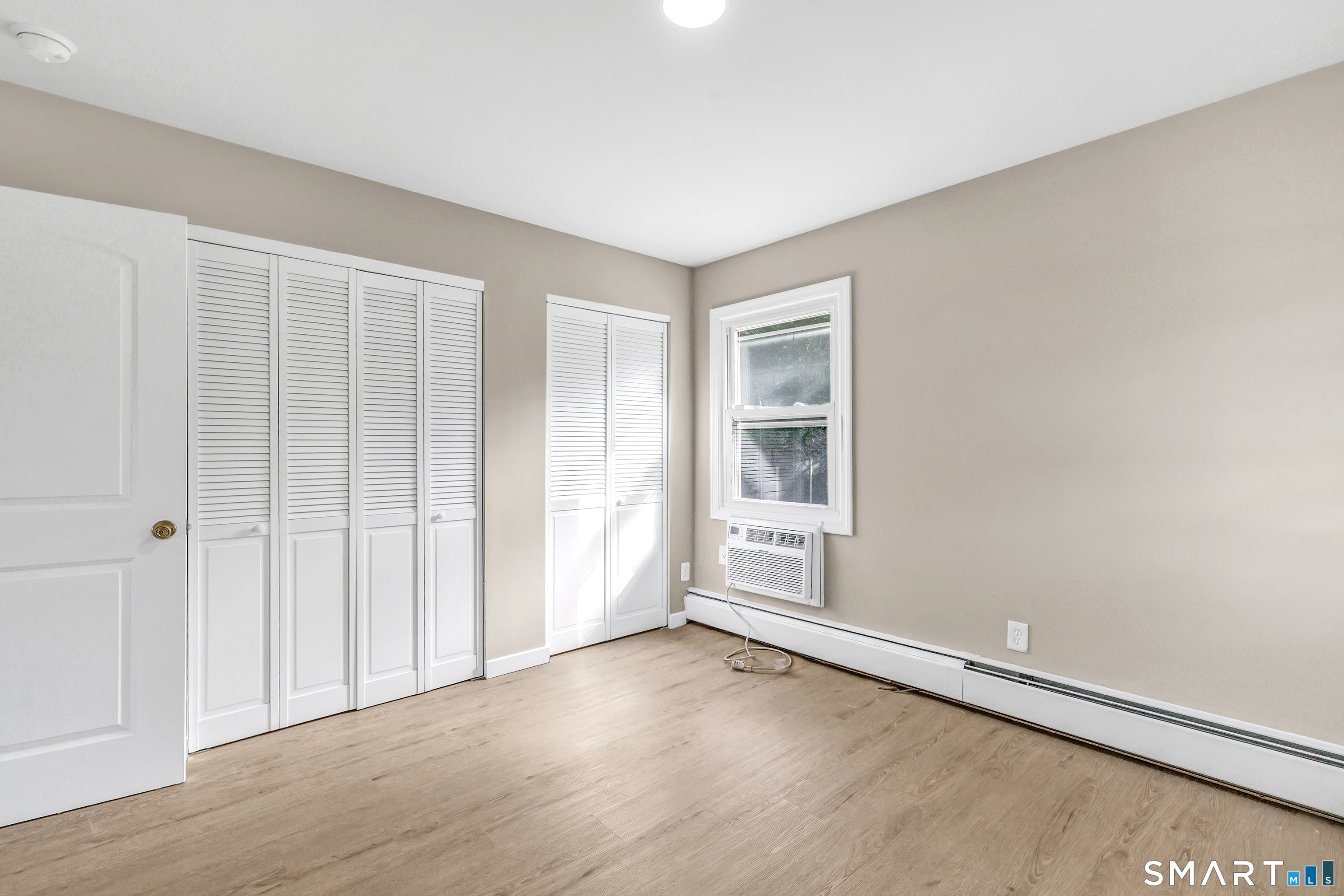 77 Meadow Lark Road Naugatuck, CT 06770 - Photo 18 of 40 Main Floor - Bedroom, vinyl flooring, wall unit for cooling, closets