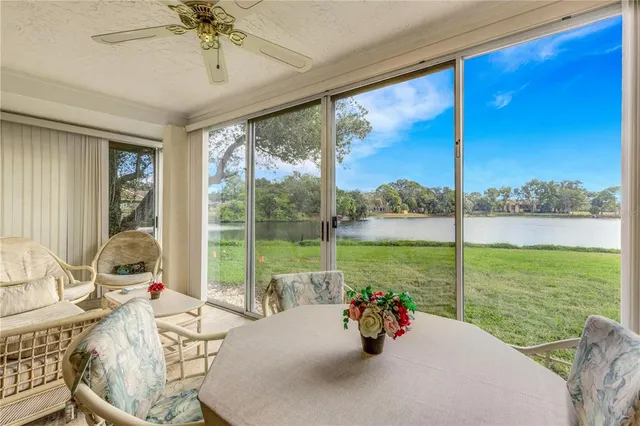 a view of a dining room with furniture window and outside view
