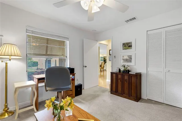 a workspace with furniture window and wooden floor