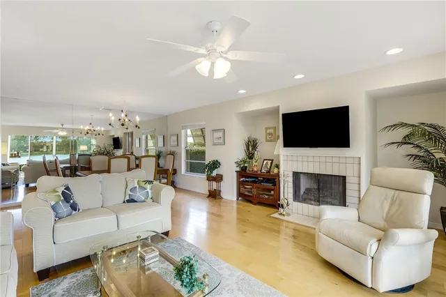 a living room with furniture fireplace and a flat screen tv