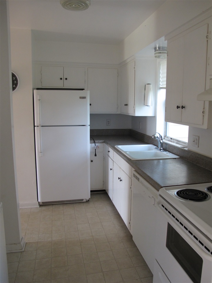 84 Lake View Court Ruckersville, VA 22968 - Photo 3 of 15 a kitchen with granite countertop a sink a stove and refrigerator