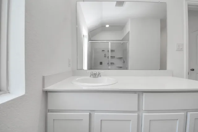 a bathroom with a sink and a mirror