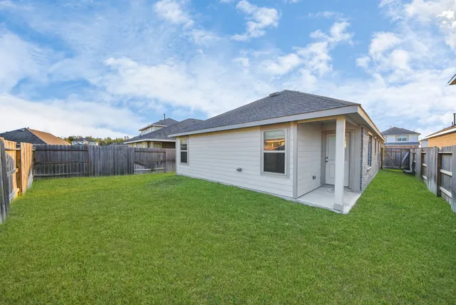a backyard of a house with lots of green space