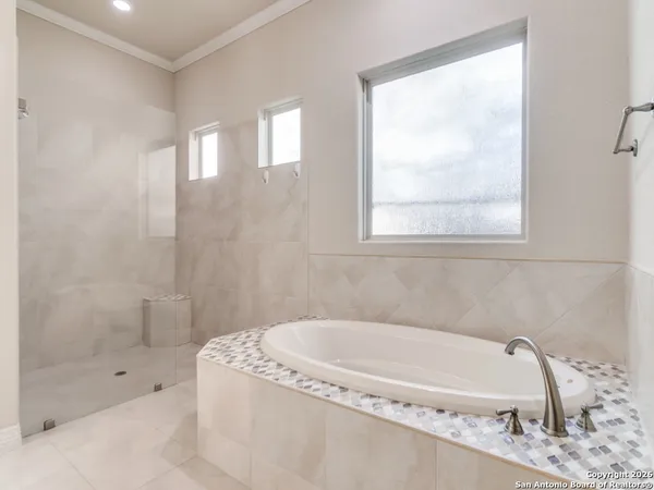 a bathroom with a sink double vanity and a mirror