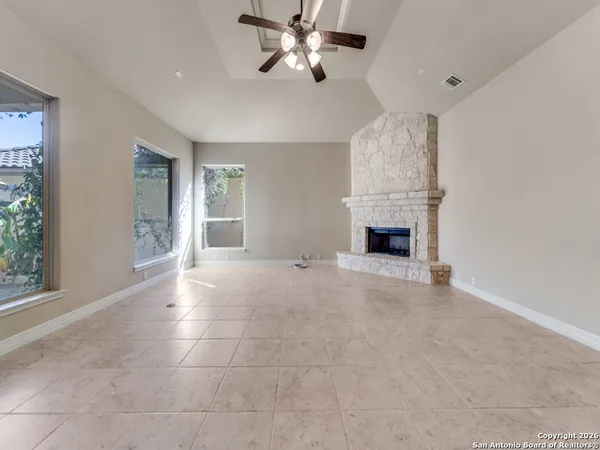 a view of livingroom with furniture and chandelier fan