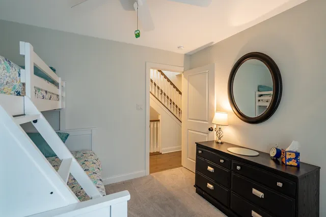 a bathroom with a sink a mirror and a vanity