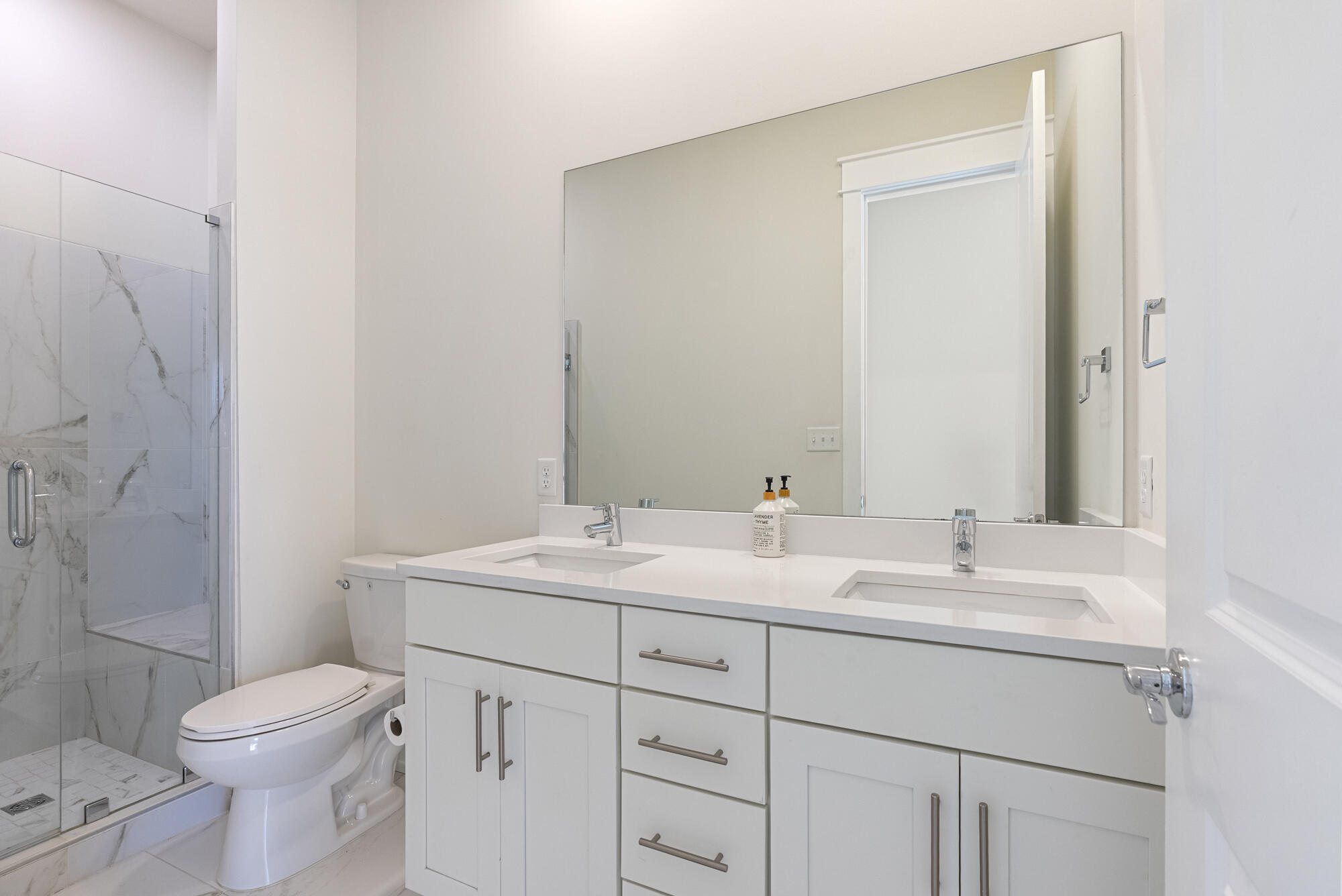 79 Beach View Drive Inlet Beach, FL 32461 - Photo 15 of 41 a bathroom with a toilet a sink and a mirror