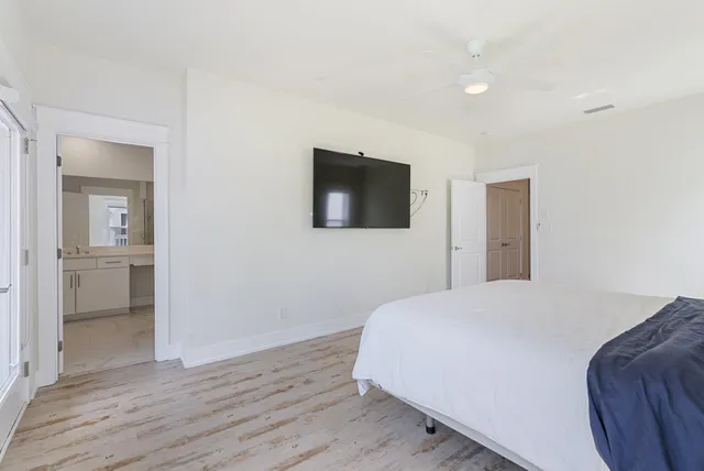 a bedroom with a bed and a hallway