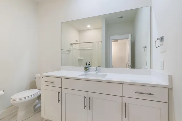 a bathroom with a shower and a bath tub
