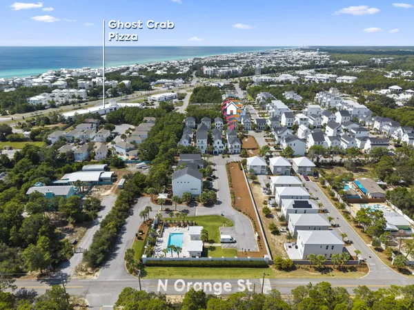 an aerial view of residential building with parking