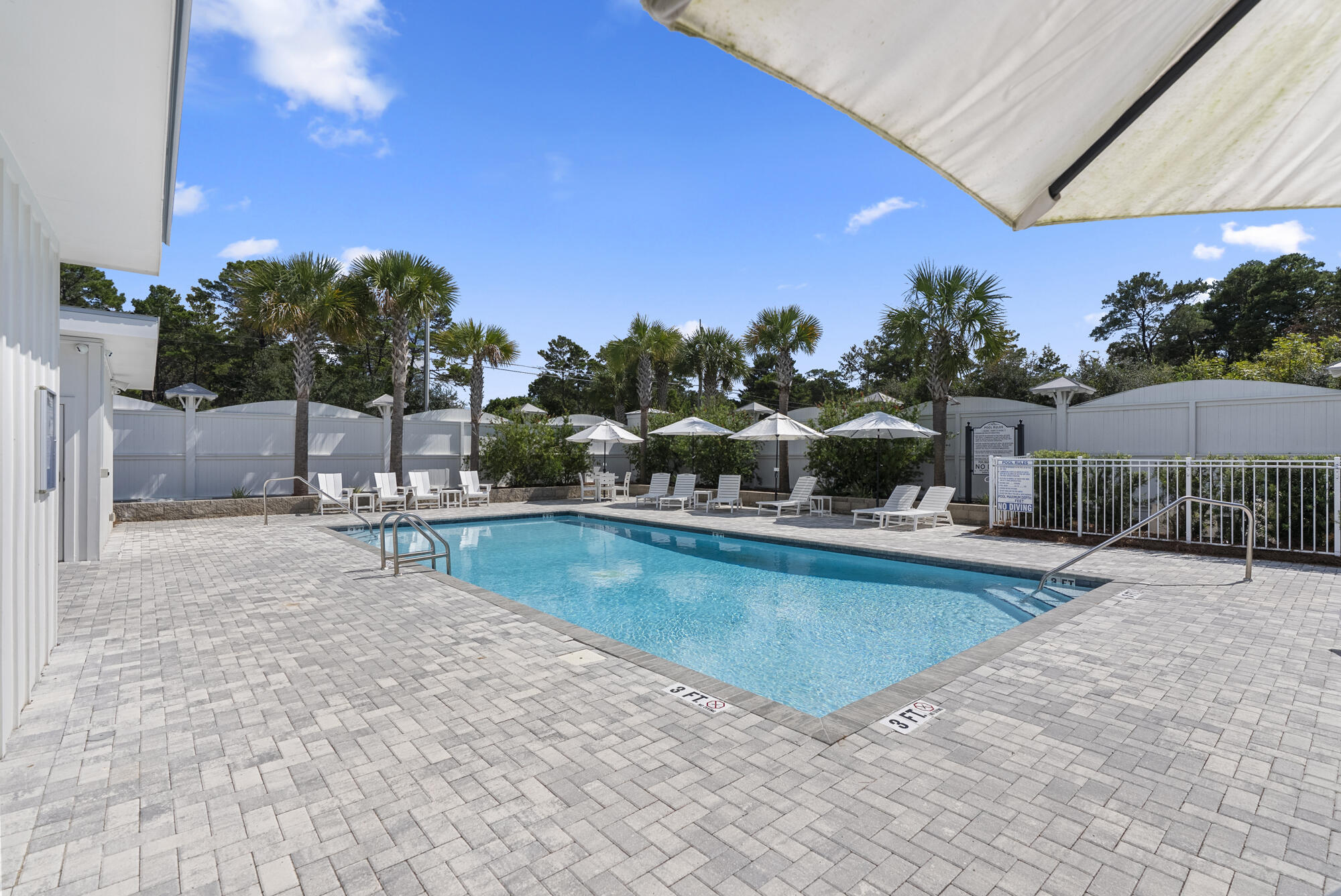 79 Beach View Drive Inlet Beach, FL 32461 - Photo 34 of 41 a view of a swimming pool with a table and chairs