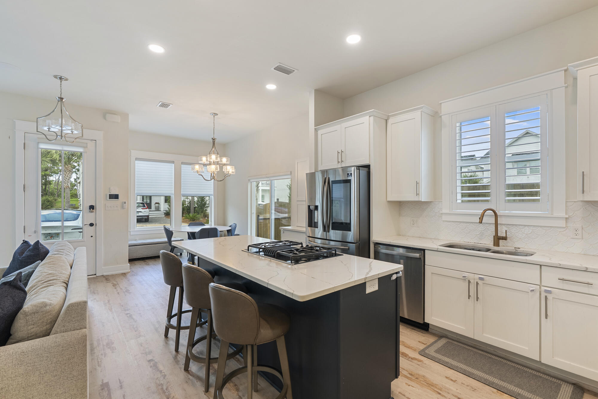 79 Beach View Drive Inlet Beach, FL 32461 - Photo 8 of 41 a kitchen that has a table chairs in it and wooden floors