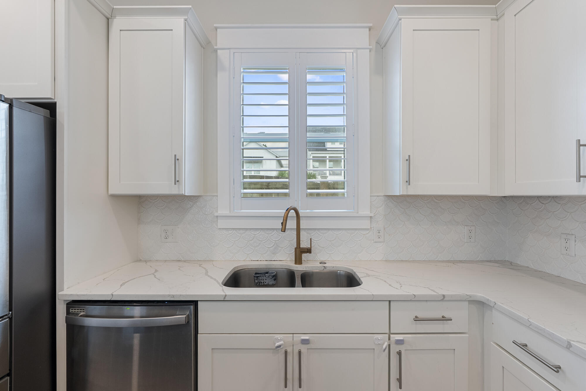 79 Beach View Drive Inlet Beach, FL 32461 - Photo 9 of 41 a kitchen with a sink cabinets and window