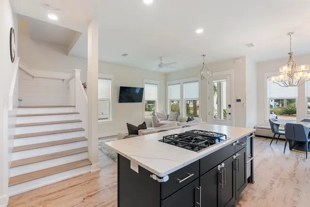 a kitchen with a stove a sink and a refrigerator