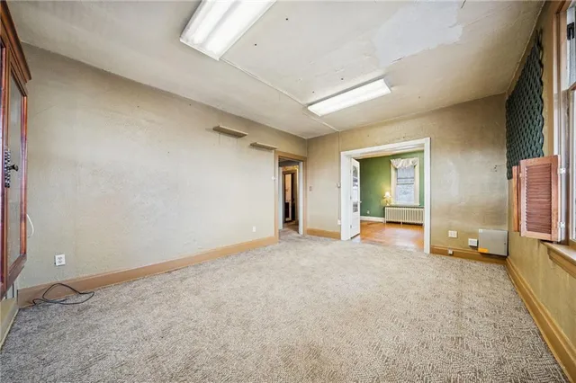 a view of a hallway with a living room