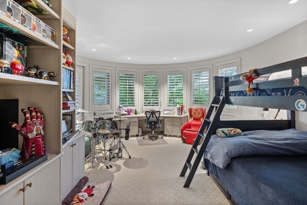99 Baldpate Hill Road Newton, MA 02459 - Photo 15 of 28 a bedroom with furniture and a flat screen tv
