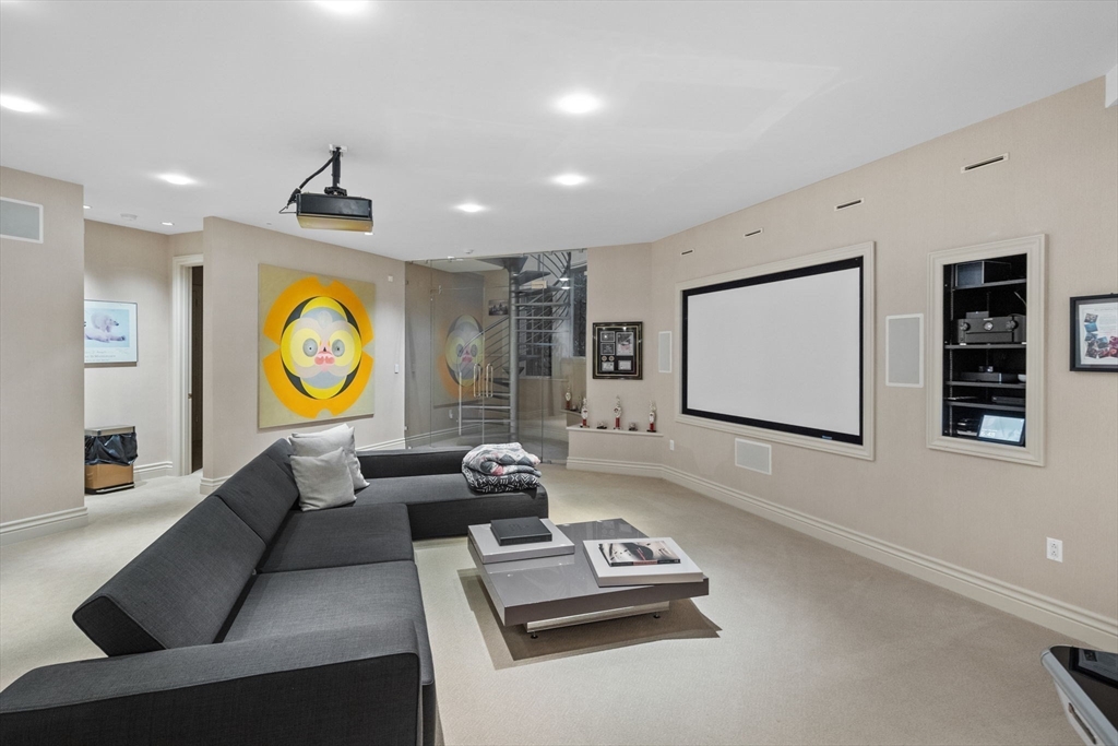 99 Baldpate Hill Road Newton, MA 02459 - Photo 17 of 28 a living room with furniture and a flat screen tv