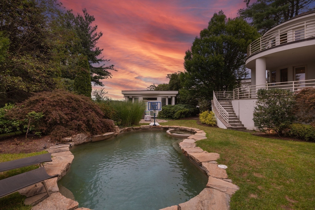 99 Baldpate Hill Road Newton, MA 02459 - Photo 28 of 28 a view of a house with pool and a yard