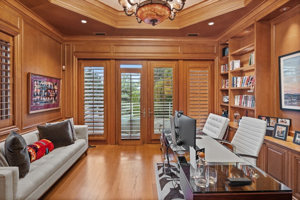 99 Baldpate Hill Road Newton, MA 02459 - Photo 10 of 28 a living room with furniture and a floor to ceiling window