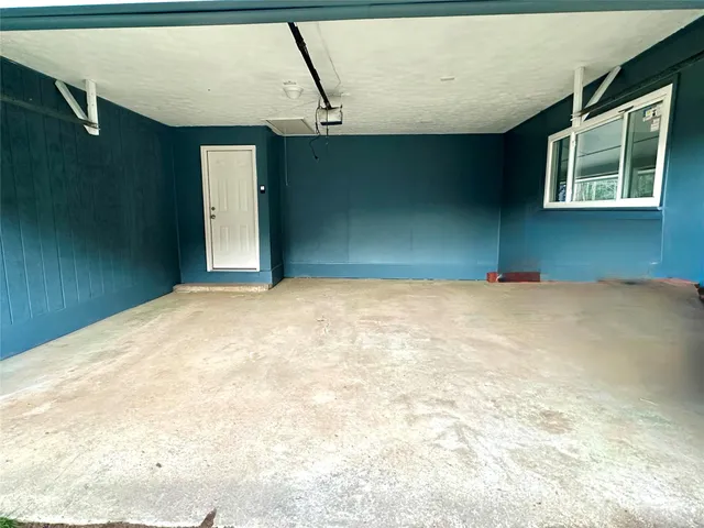 a view of a big room with windows