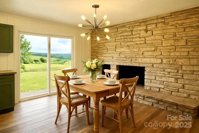 a dining room with furniture and wooden floor