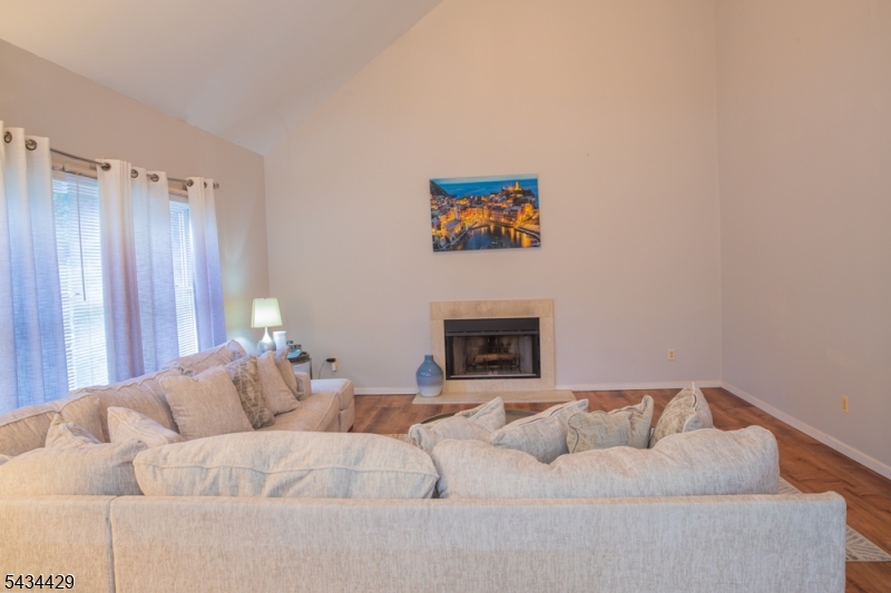 4 Lewis Hollow Road Randolph, NJ 07945 - Photo 4 of 10 a living room with furniture and a fireplace