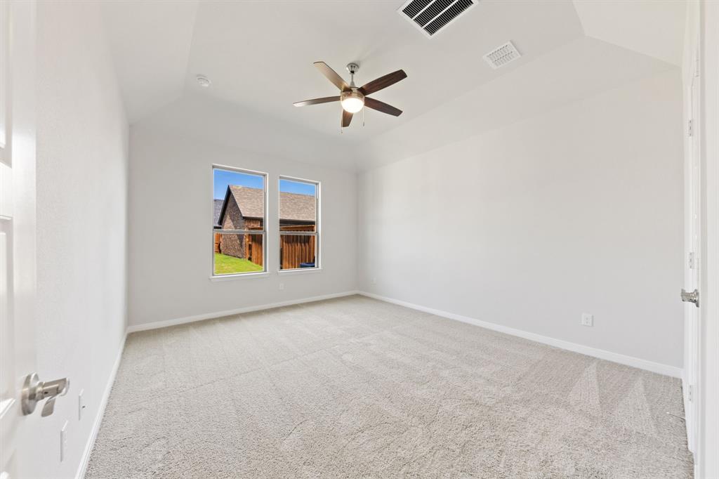 1844 Rosedale Avenue Van Alstyne, TX 75495 - Photo 11 of 26 High ceilings, large windows, plush carpeting...this new dreamy owner's suite is waiting for you!