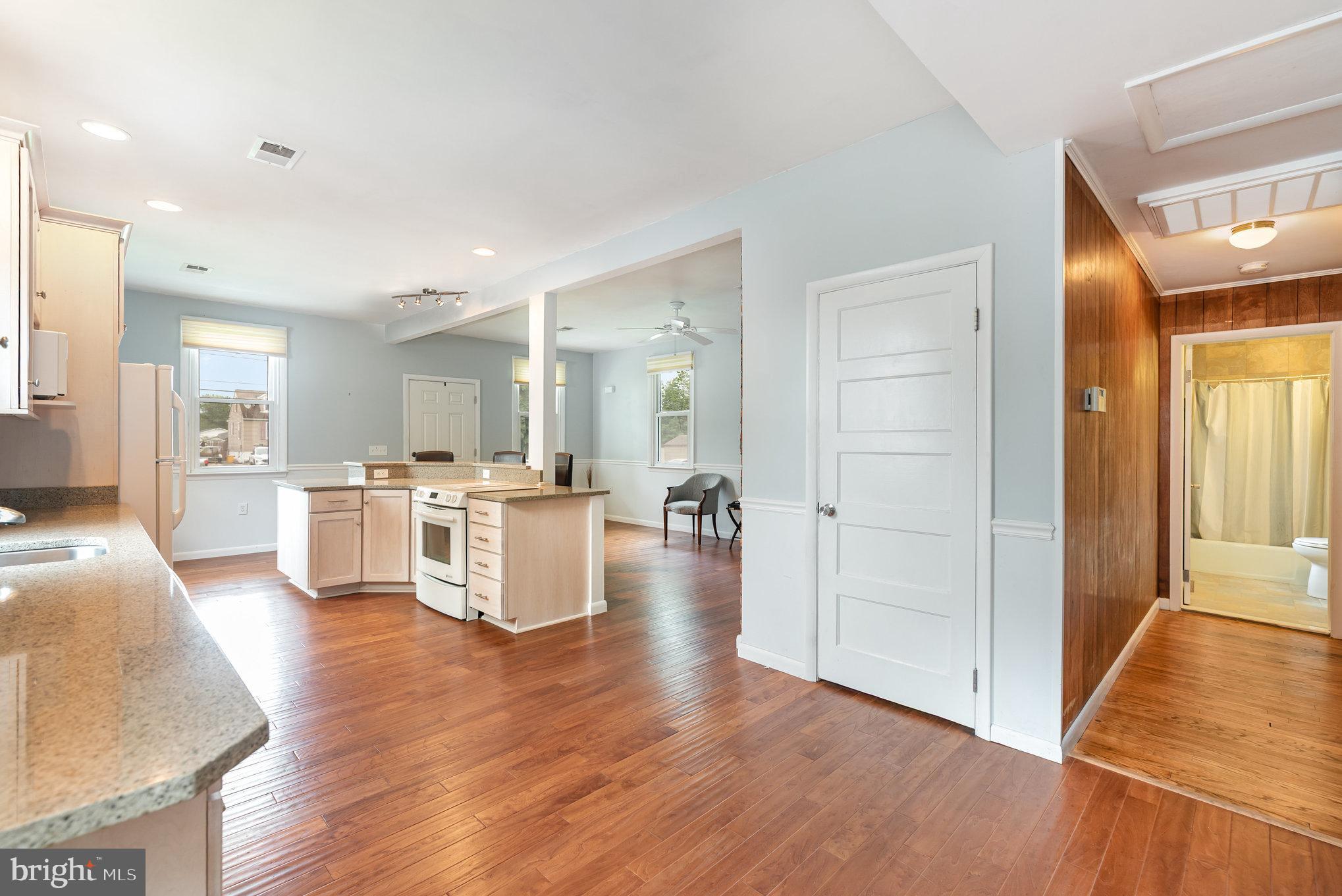 326 Wye Road Baltimore, MD 21221 - Photo 11 of 56 a view of open kitchen with white cabinets and refrigerator