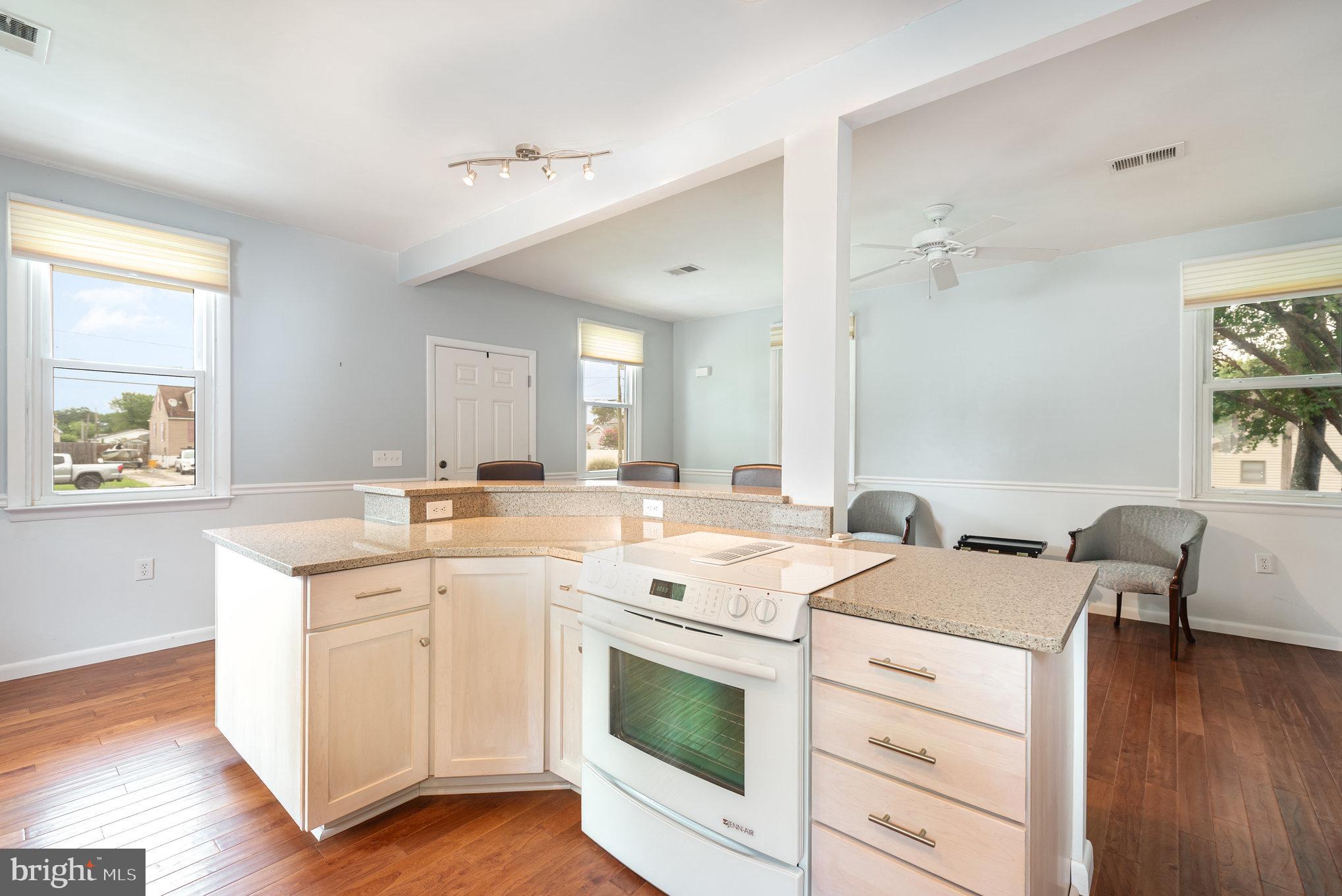 326 Wye Road Baltimore, MD 21221 - Photo 12 of 56 a view of a kitchen counter space a sink wooden floor and a window