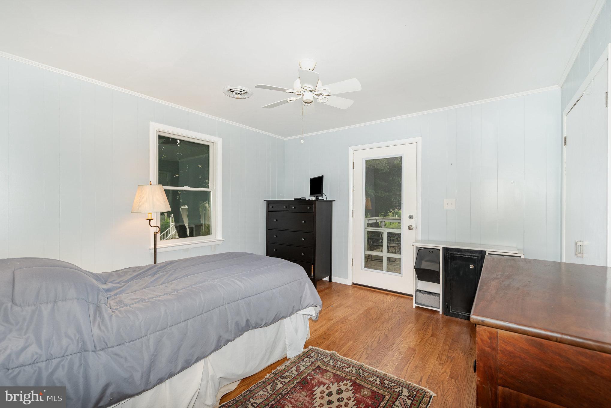 326 Wye Road Baltimore, MD 21221 - Photo 15 of 56 a bedroom with a bed and wooden floor
