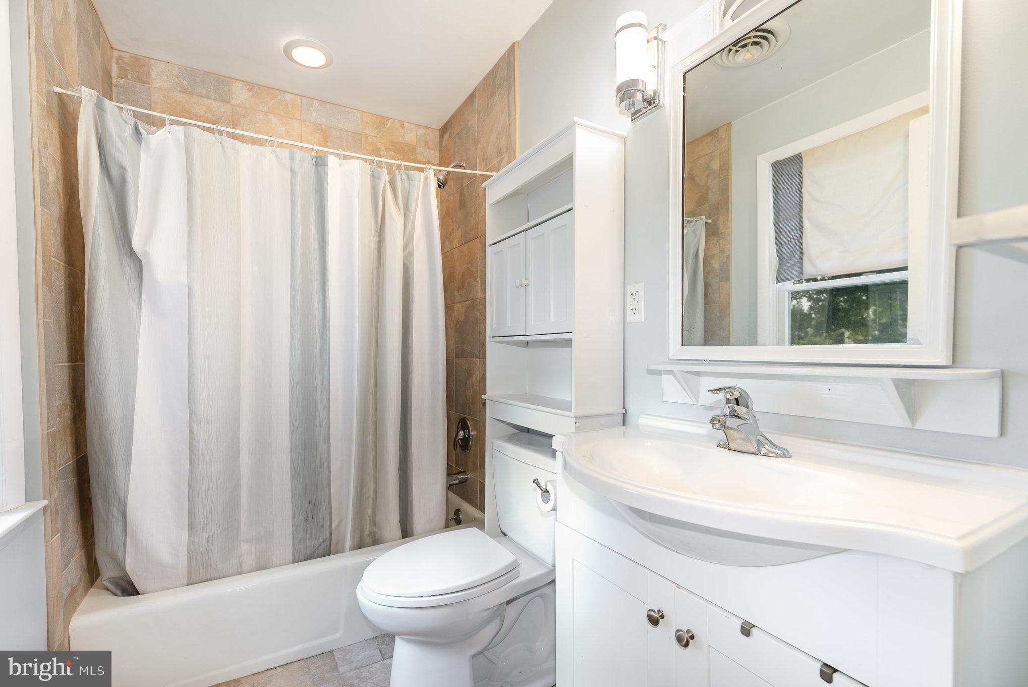 326 Wye Road Baltimore, MD 21221 - Photo 18 of 56 a bathroom with a sink toilet and shower