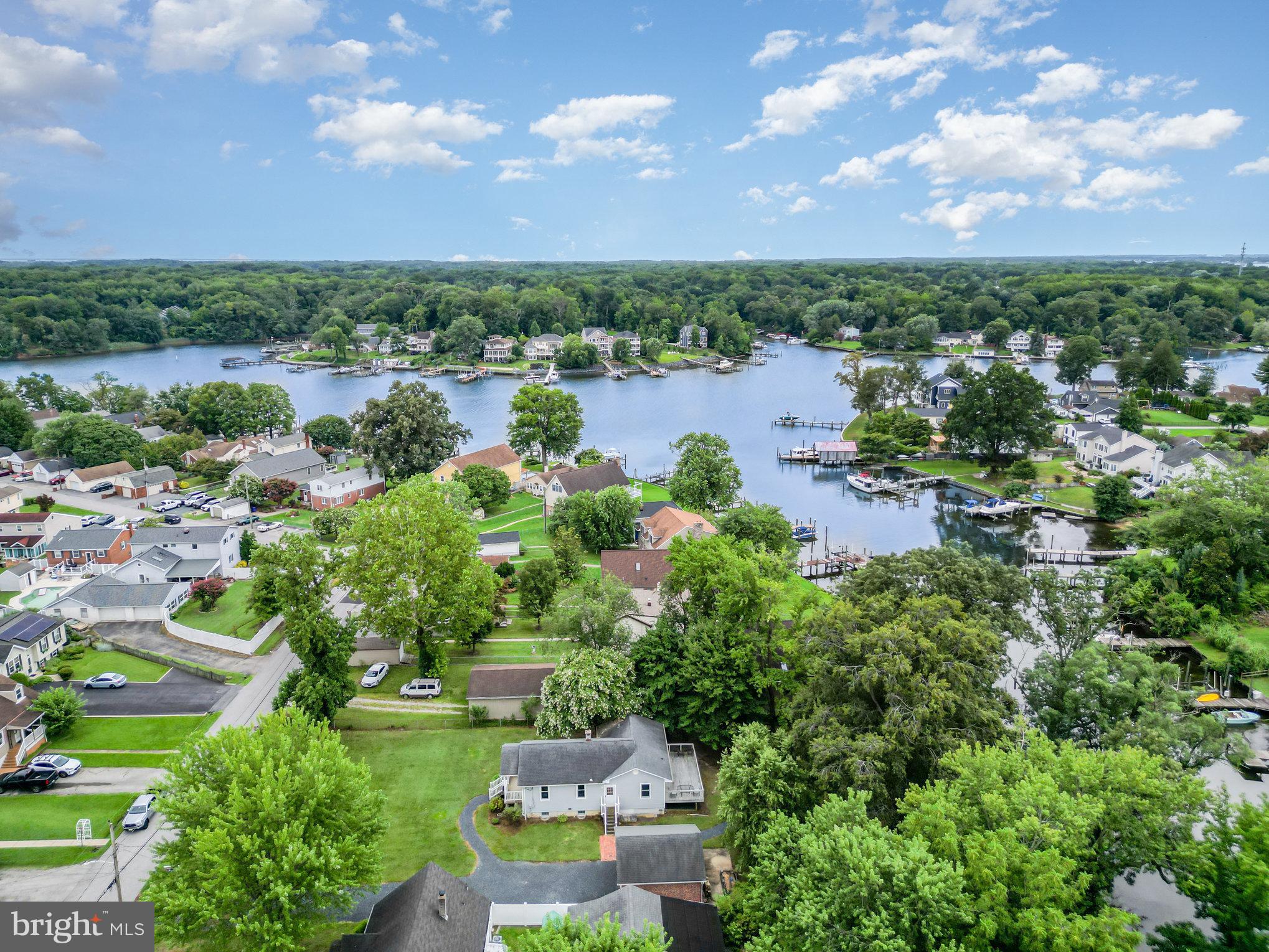 326 Wye Road Baltimore, MD 21221 - Photo 20 of 56 a view of a lake with houses in back