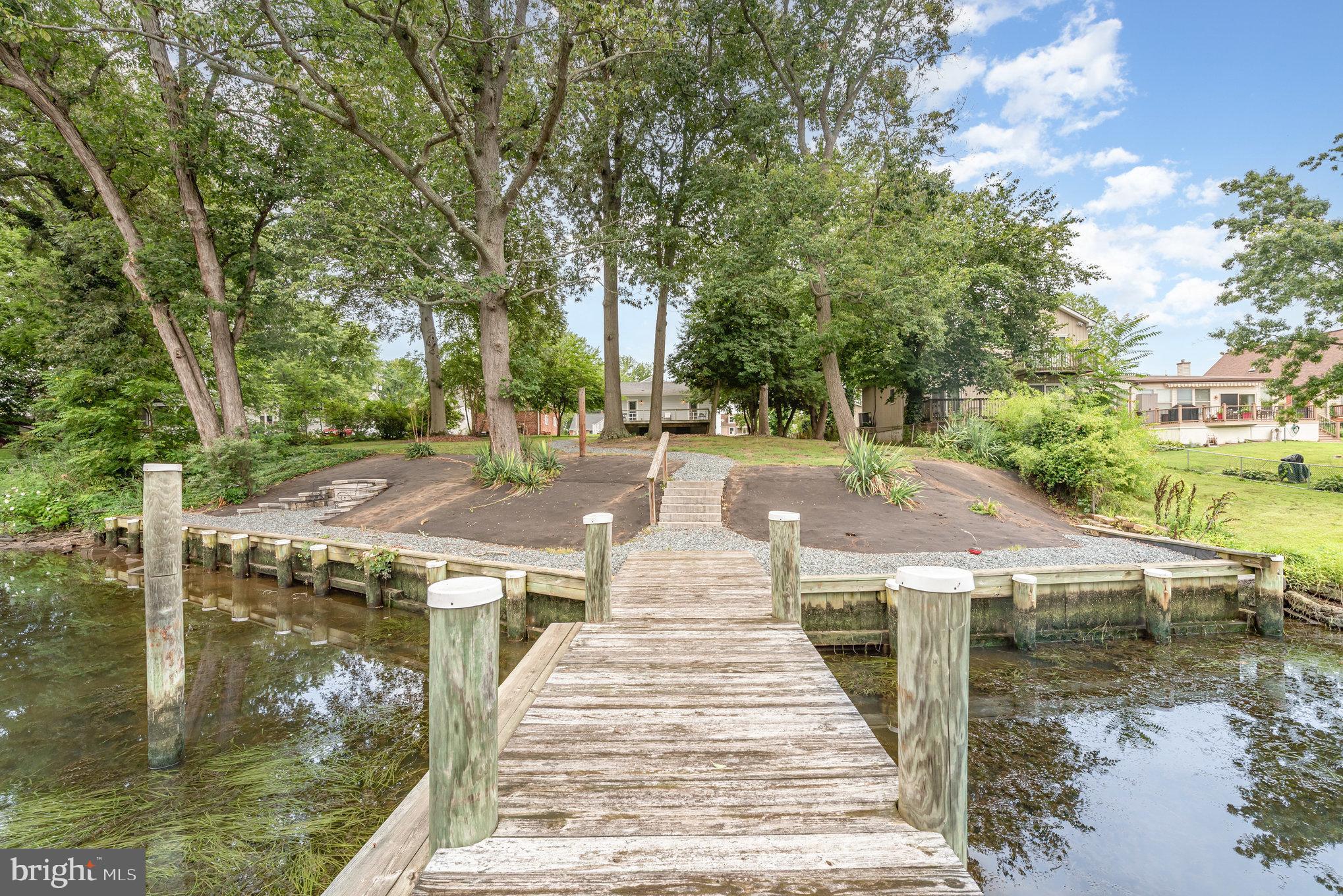 326 Wye Road Baltimore, MD 21221 - Photo 29 of 56 a pathway of a house with yard and lake view