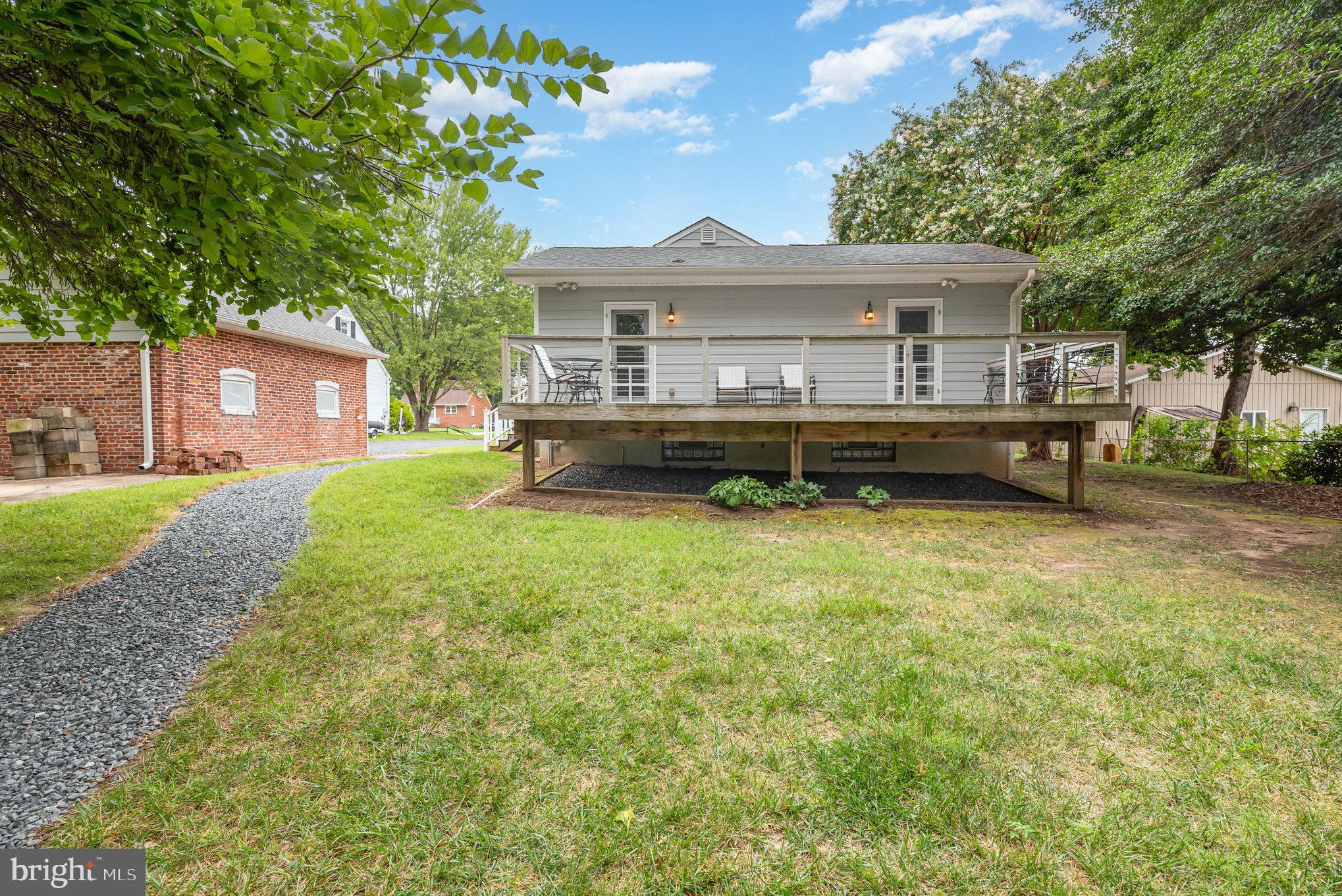 326 Wye Road Baltimore, MD 21221 - Photo 55 of 56 a front view of a house with a garden and yard