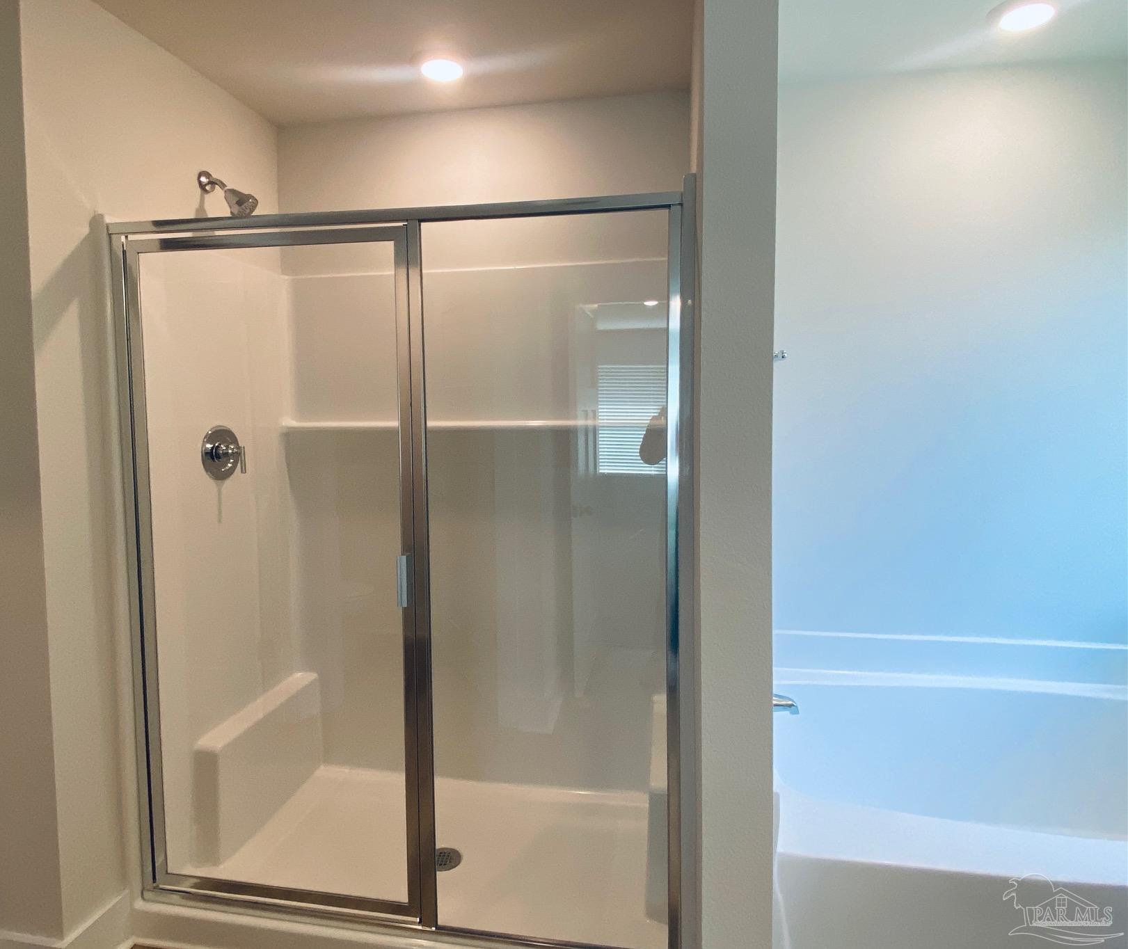 3021 Serviceberry Road Cantonment, FL 32533 - Photo 12 of 21 a bathroom with a glass shower door