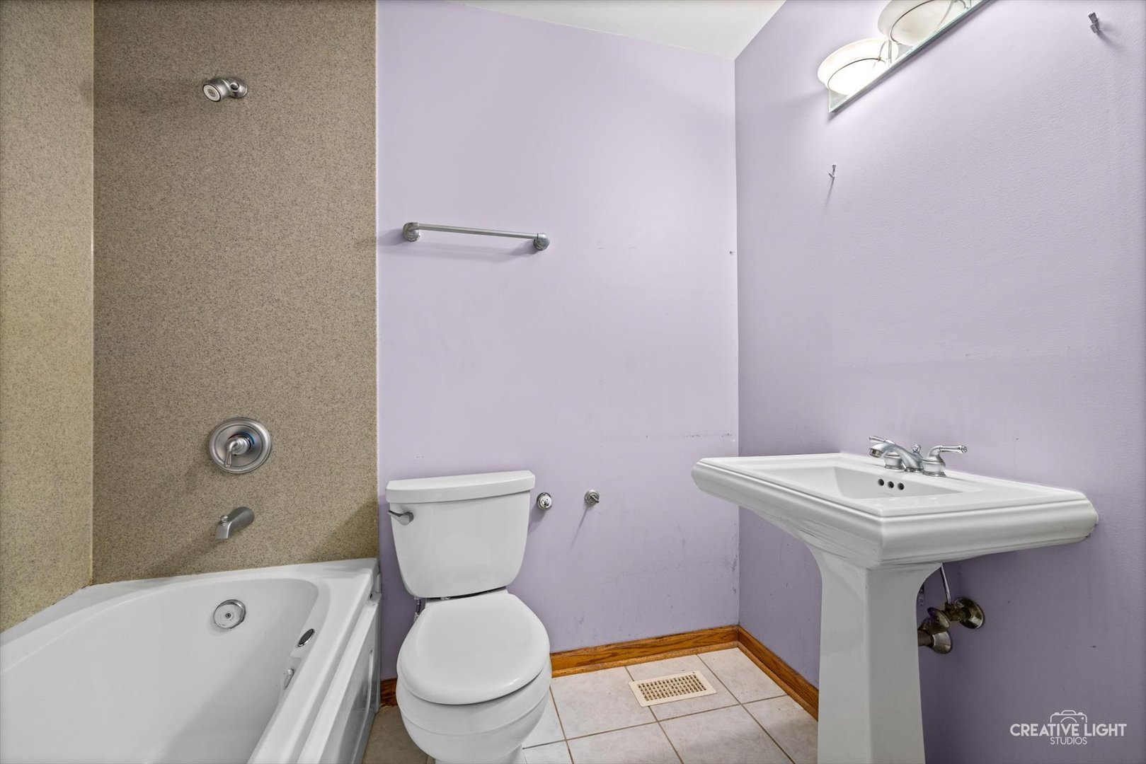 1325 East Lake Avenue Glenview, IL 60025 - Photo 27 of 43 a bathroom with a sink toilet and bathtub