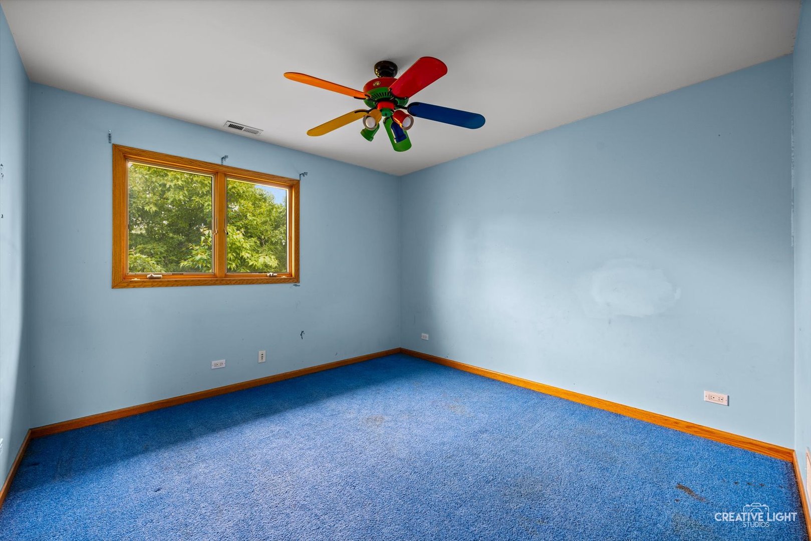 1325 East Lake Avenue Glenview, IL 60025 - Photo 30 of 43 a view of an empty room with ceiling fan and a window