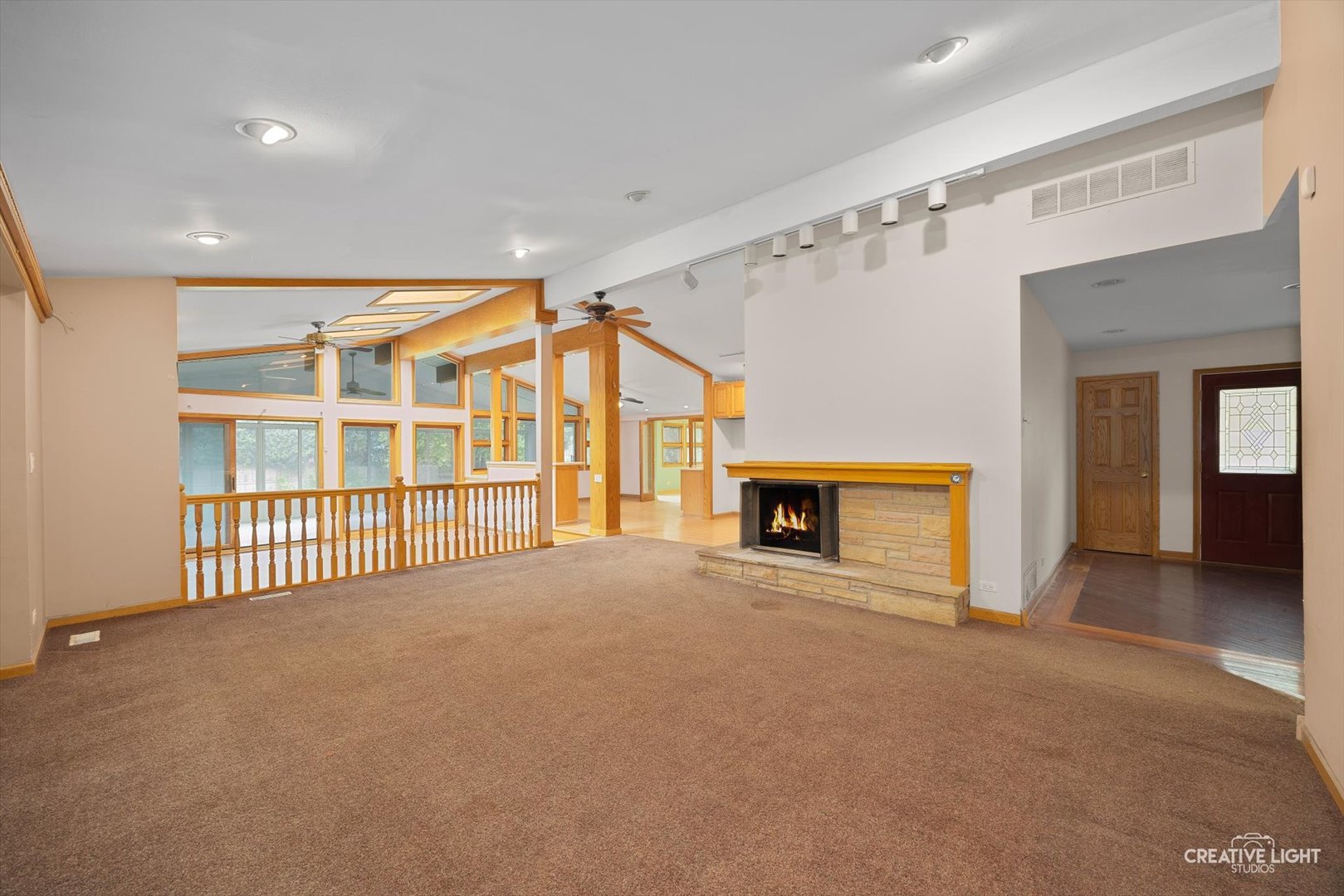 1325 East Lake Avenue Glenview, IL 60025 - Photo 4 of 43 a view of an empty room with a fireplace and a window