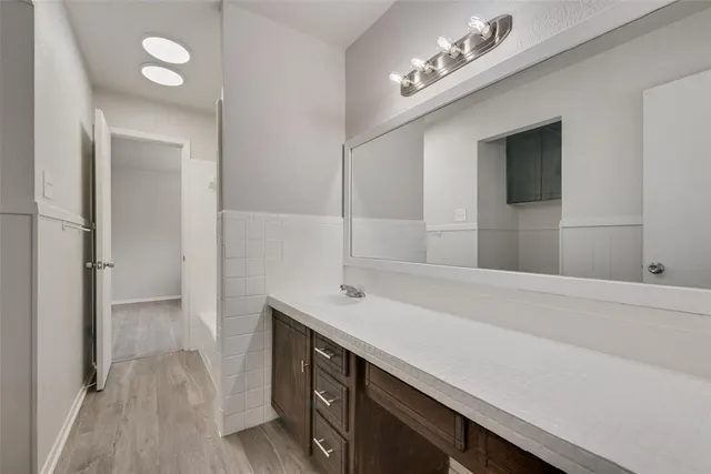 a bathroom with a sink and a mirror