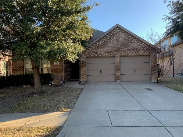 a view of a house with a tree