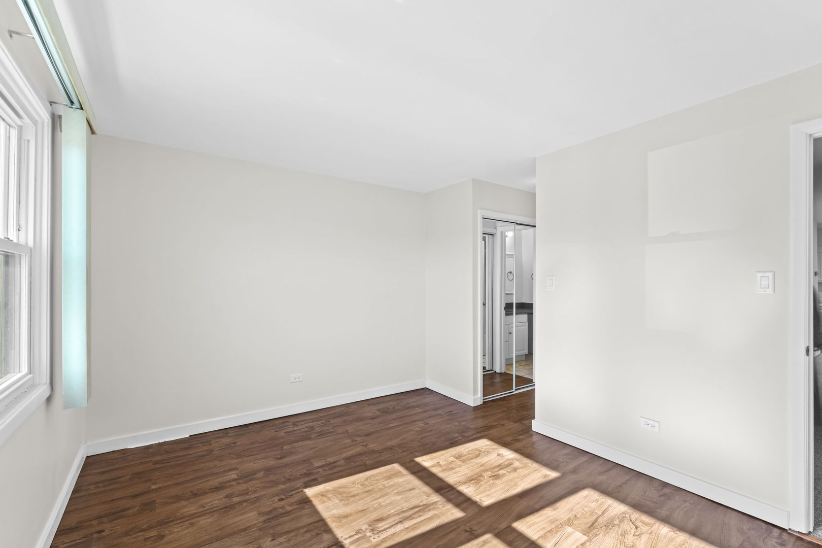 5880 Rembrandt Court, Unit C Hanover Park, IL 60133 - Photo 11 of 22 a view of an empty room and window